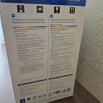 Brother Inkjet multi-function center / printer and a paper shredder with an assortment of alarm clocks