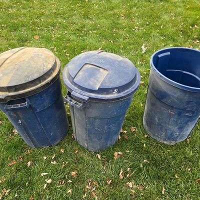 Three garbage cans - two with lids