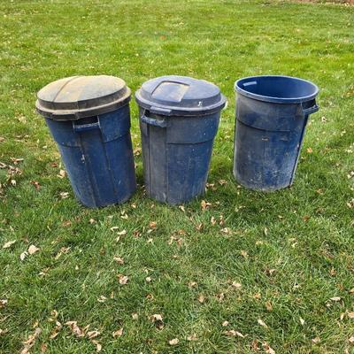 Three garbage cans - two with lids