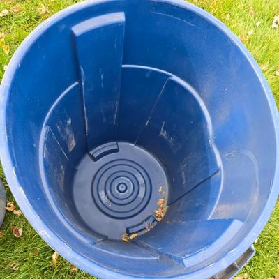 Three garbage cans - two with lids