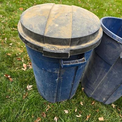 Three garbage cans - two with lids