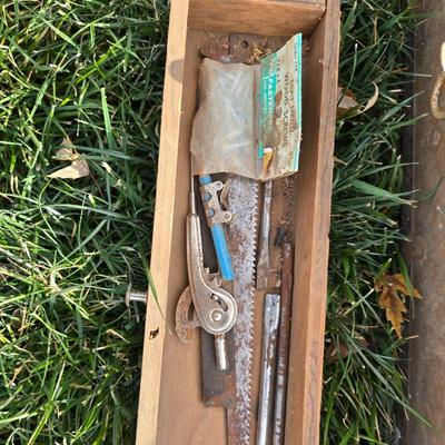 Two old rusty metal boxes with contents of old tools and misc.