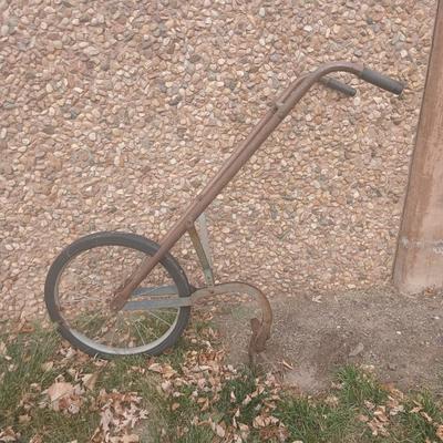 Antique hand driven garden plow