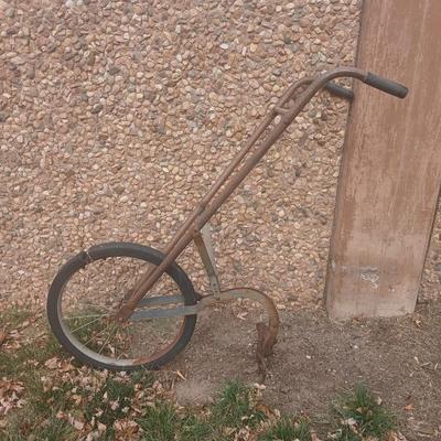 Antique hand driven garden plow