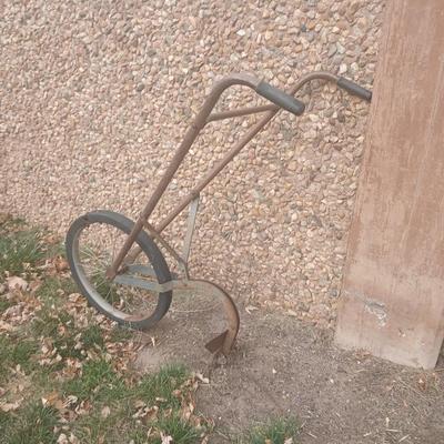 Antique hand driven garden plow