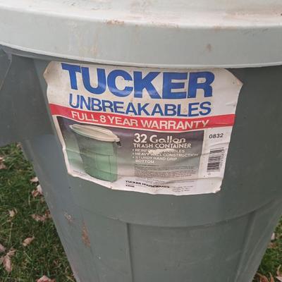 Three garbage cans 2 with lids