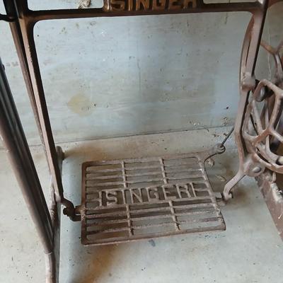 Vintage Singer treadle sewing machine with a wooden cabinet