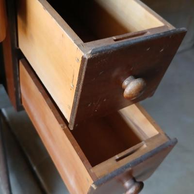 Vintage Singer treadle sewing machine with a wooden cabinet