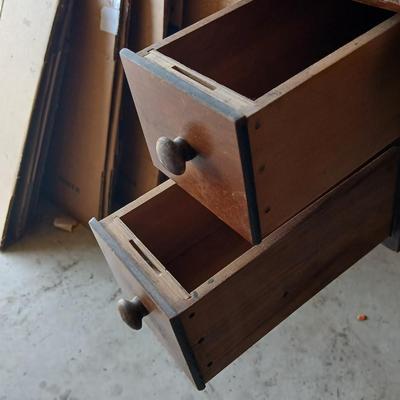 Vintage Singer treadle sewing machine with a wooden cabinet