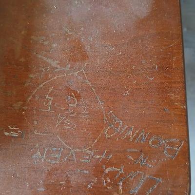 Vintage Singer treadle sewing machine with a wooden cabinet