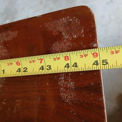 Vintage Singer treadle sewing machine with a wooden cabinet