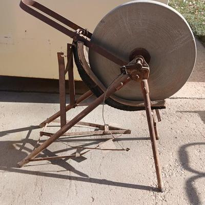 Antique foot-powered grindstone