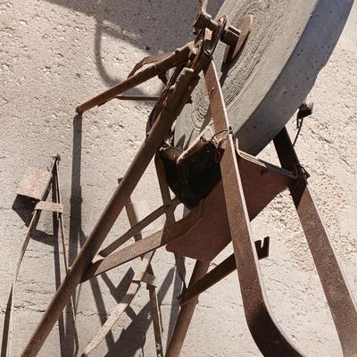 Antique foot-powered grindstone