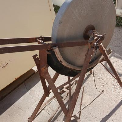 Antique foot-powered grindstone