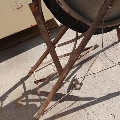 Antique foot-powered grindstone