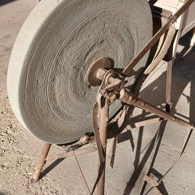 Antique foot-powered grindstone