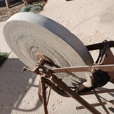 Antique foot-powered grindstone