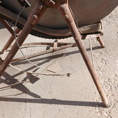 Antique foot-powered grindstone