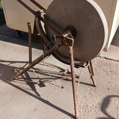 Antique foot-powered grindstone