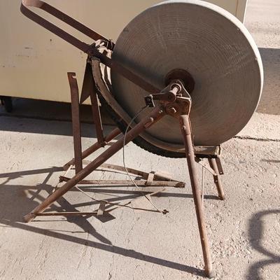 Antique foot-powered grindstone