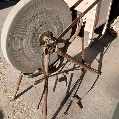 Antique foot-powered grindstone
