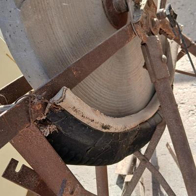 Antique foot-powered grindstone