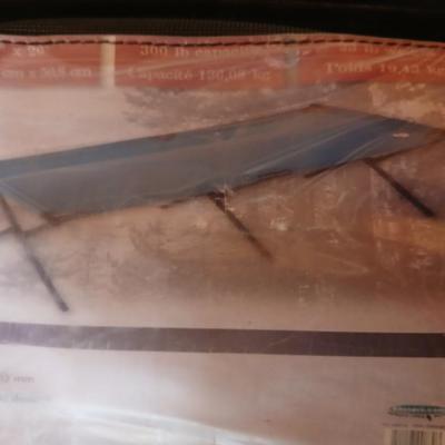 Bass Pro Folding portable cot in storage bag