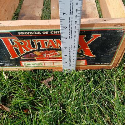 Two old wooden crateswith a round wood container