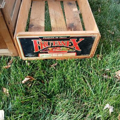 Two old wooden crateswith a round wood container