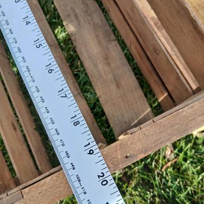 Two old wooden crateswith a round wood container