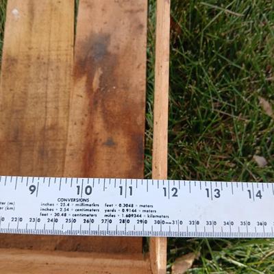 Two old wooden crateswith a round wood container