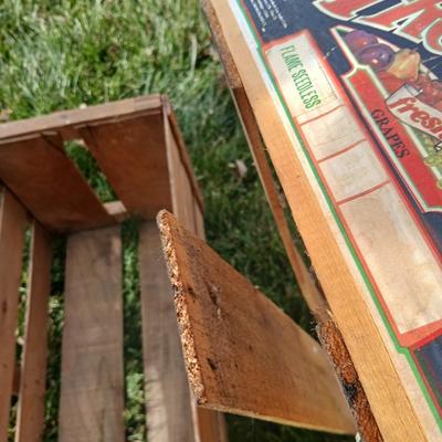 Two old wooden crateswith a round wood container