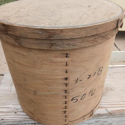 Two old wooden crateswith a round wood container
