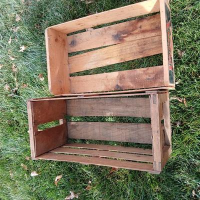 Two old wooden crateswith a round wood container
