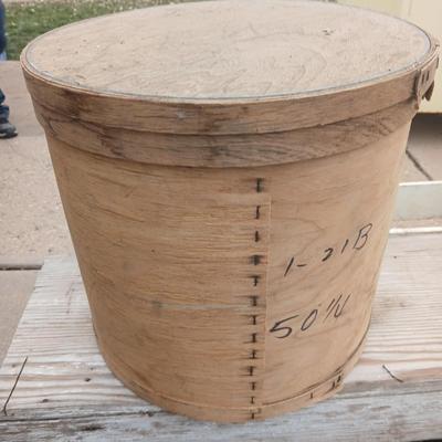 Two old wooden crateswith a round wood container