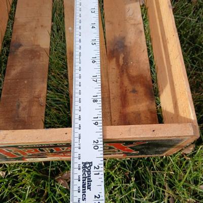 Two old wooden crateswith a round wood container