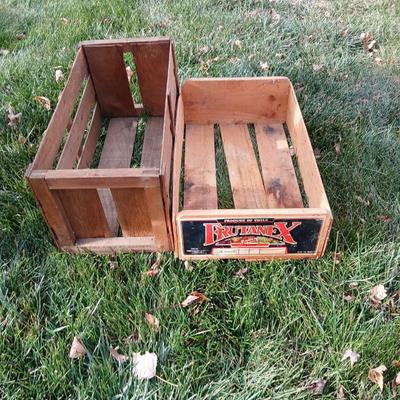 Two old wooden crateswith a round wood container