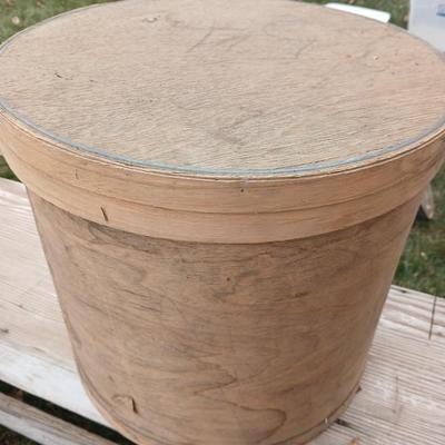 Two old wooden crateswith a round wood container