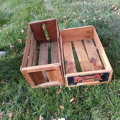Two old wooden crateswith a round wood container