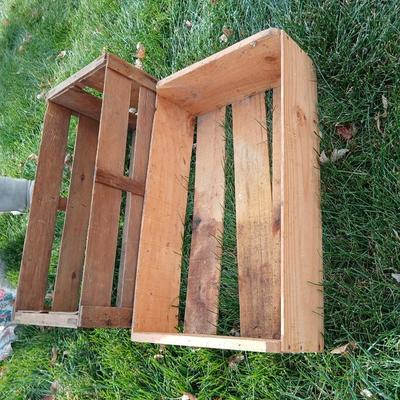 Two old wooden crateswith a round wood container