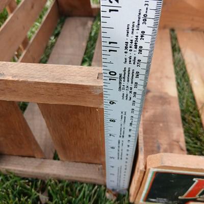 Two old wooden crateswith a round wood container