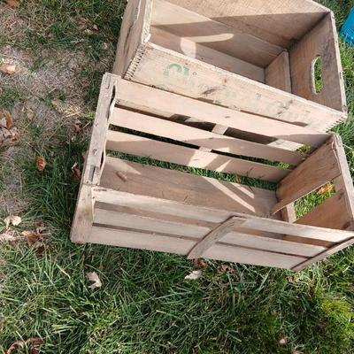 Wood crates with round wooden cheese container