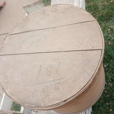 Wood crates with round wooden cheese container