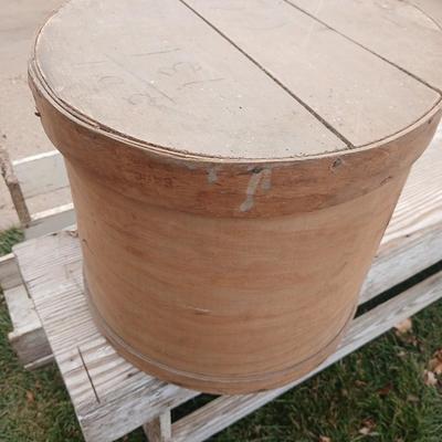 Wood crates with round wooden cheese container
