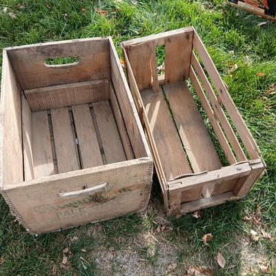 Wood crates with round wooden cheese container