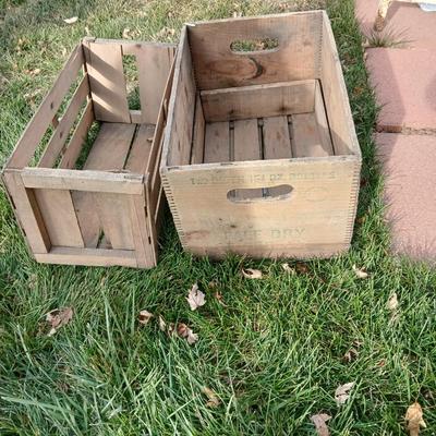 Wood crates with round wooden cheese container