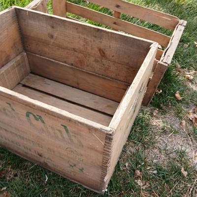 Wood crates with round wooden cheese container