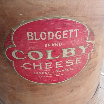 Wood crates with round wooden cheese container