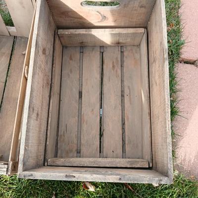 Wood crates with round wooden cheese container