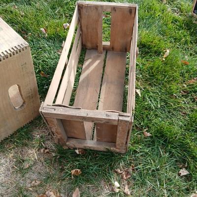 Wood crates with round wooden cheese container